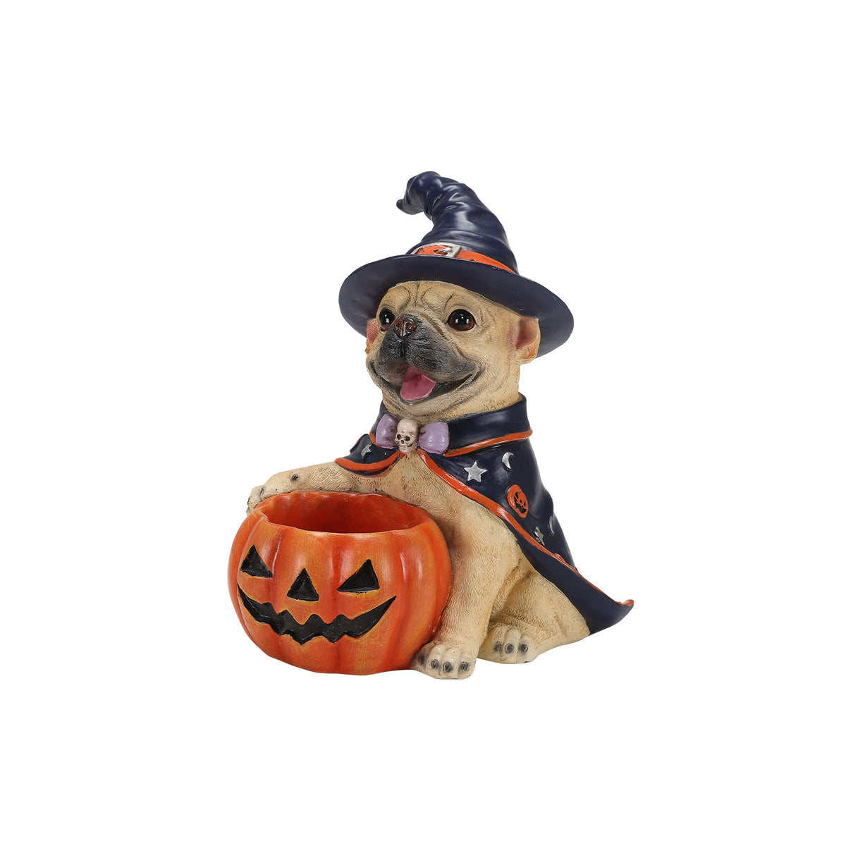 A Halloween-themed figurine of a pug dressed as a witch, wearing a black pointed hat and cape with orange trim, sitting behind an orange jack-o'-lantern bucket against a plain white background.