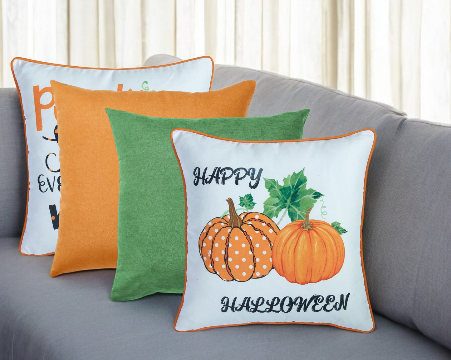 Decorative pillows with Halloween design on a gray couch