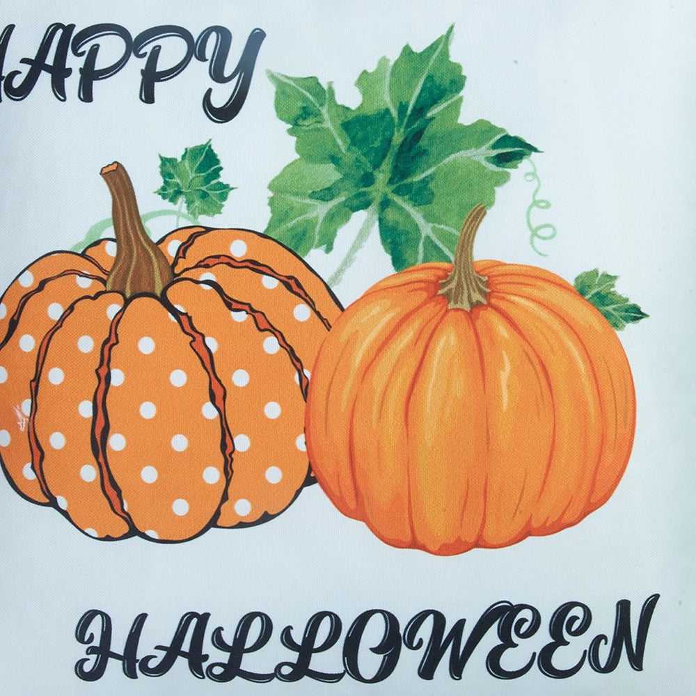 Happy Halloween text with polka dot pumpkins on a light blue background