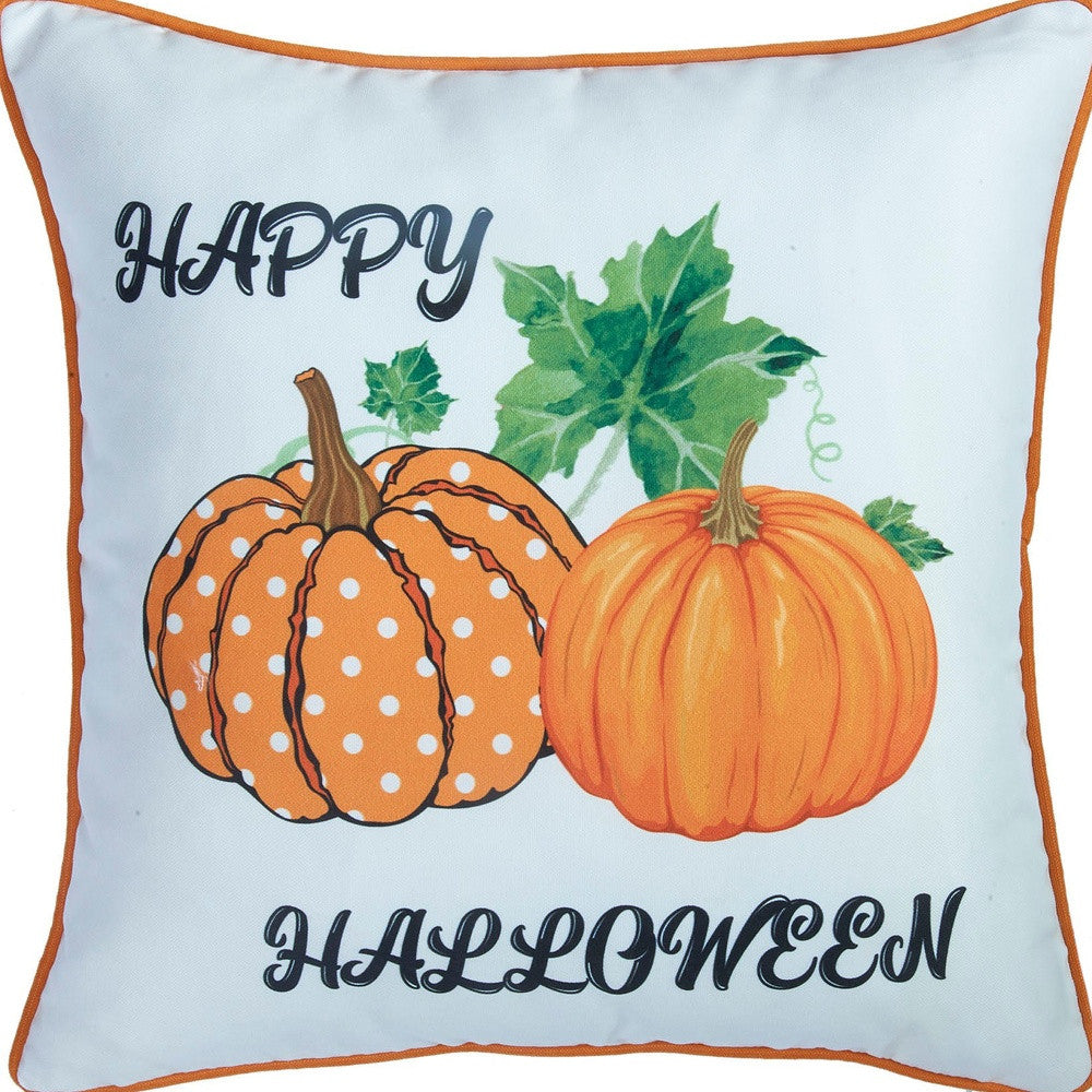 Decorative pillow with pumpkins and 'Happy Halloween' text on a light blue background