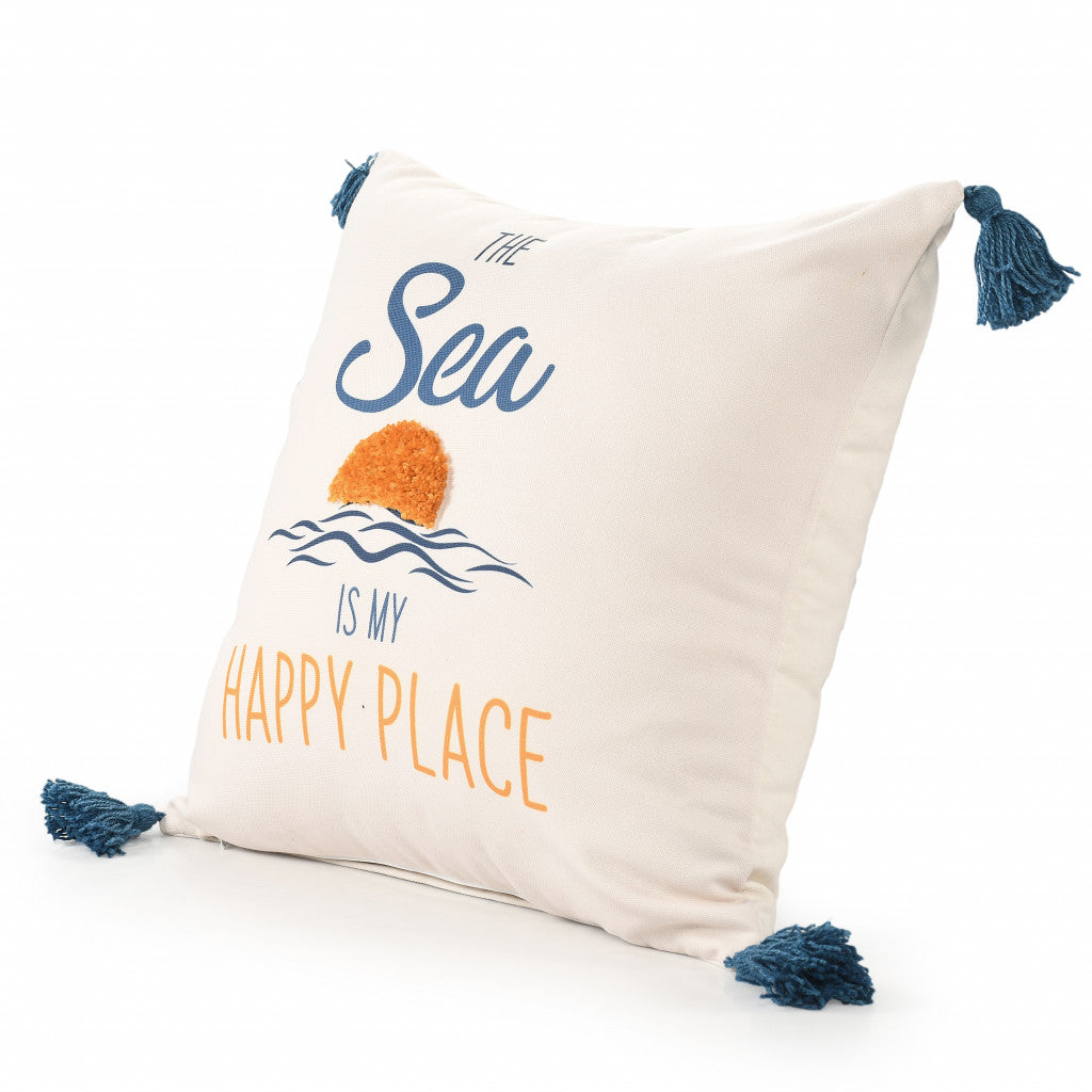 Decorative pillow with 'The Sea is My Happy Place' text and tassels on a white background