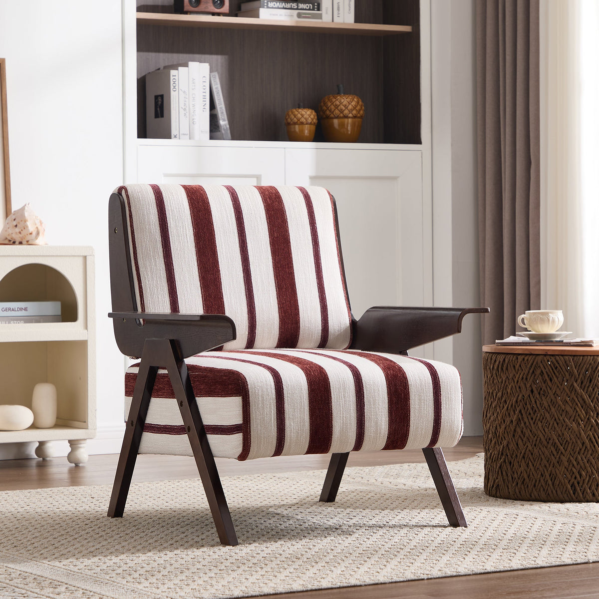 Striped armchair in a living room setting with a bookshelf and coffee table.