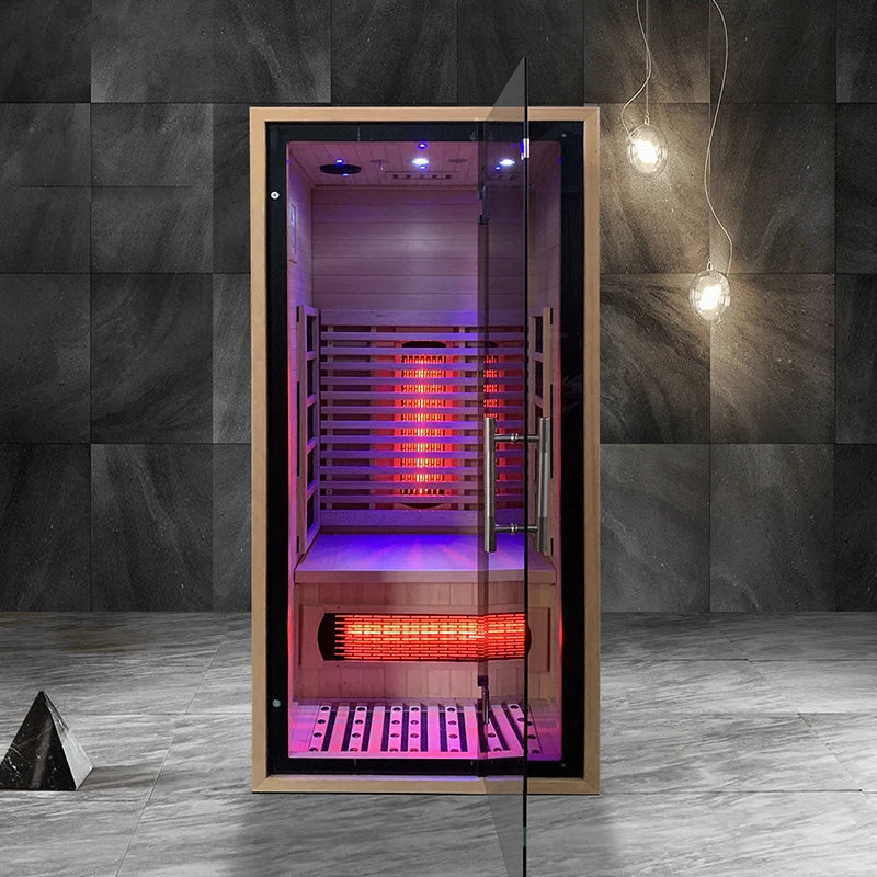 Infrared sauna with glowing lights in a dimly lit room.