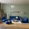 Modern living room with blue sofa, white walls, and decorative items. Red Living Room Sofa Set – 1/2/3 Seater + Ottoman Sectional Couch. 076823-f9.myshopify.com