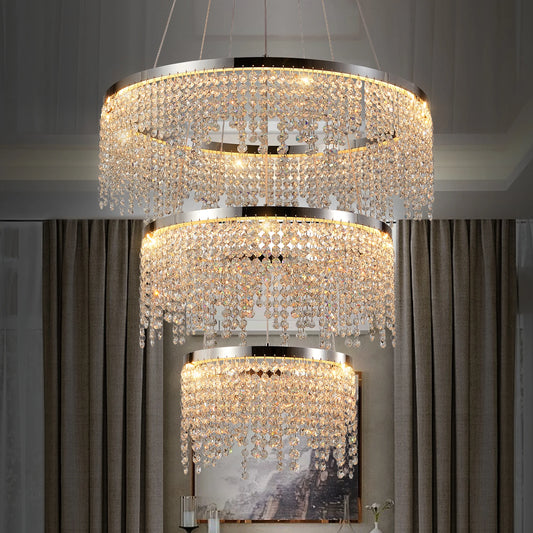 Chandelier with crystal accents in a room with curtains and a painting.