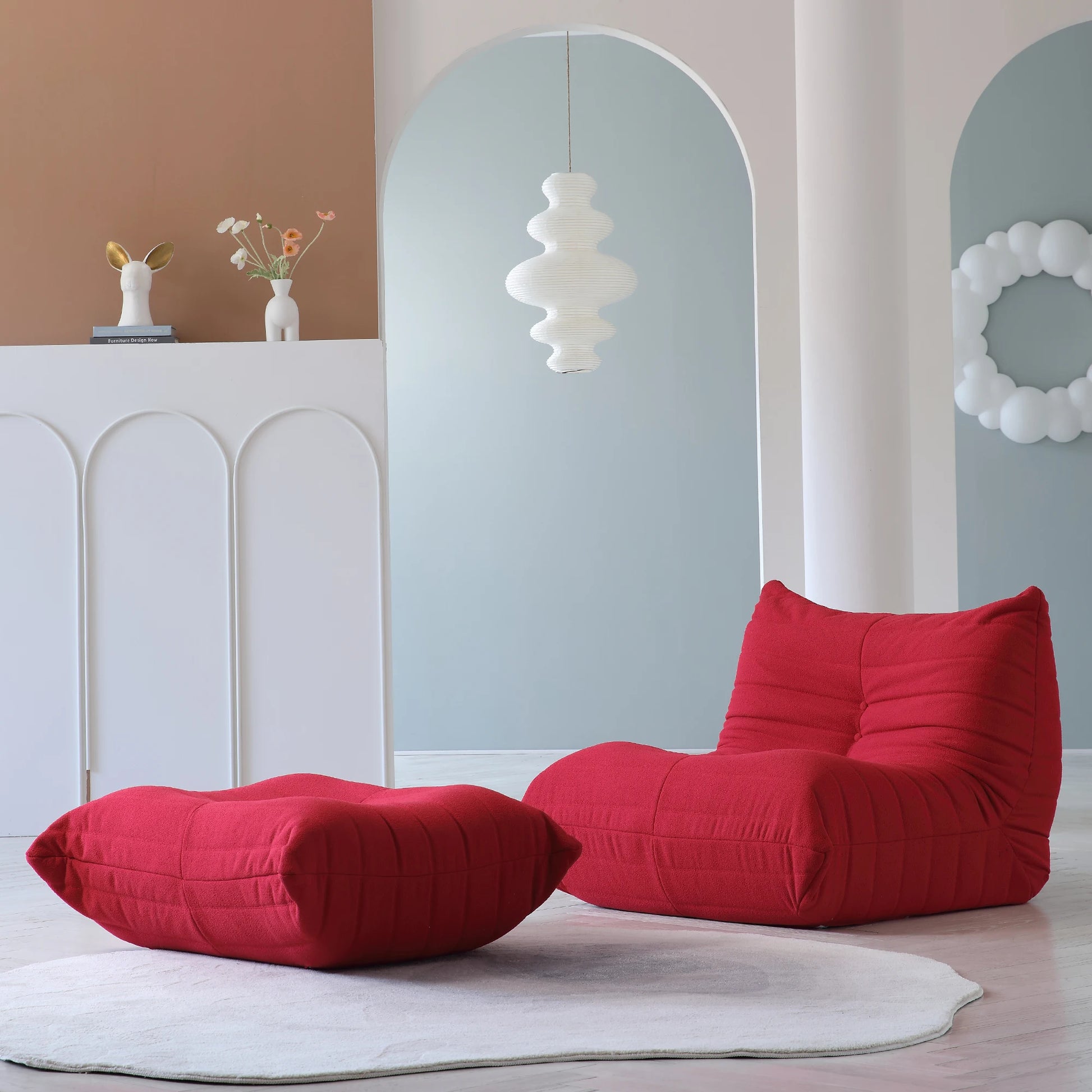 Red bean bags on a light wooden floor with a white wall and decorative elements in the background. Red Living Room Sofa Set – 1/2/3 Seater + Ottoman Sectional Couch. 076823-f9.myshopify.com