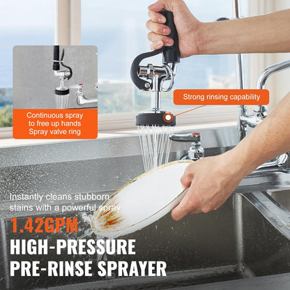 Person using a high-pressure pre-rinse sprayer to clean a dish in a kitchen sink.