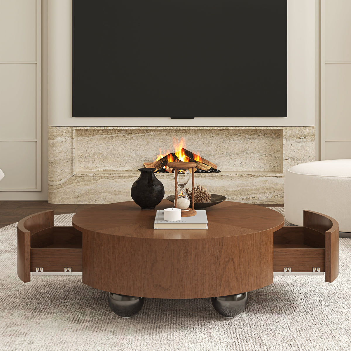 A round wooden coffee table with two pull-out side drawers and ball casters, styled in a modern living room setting in front of a fireplace.
