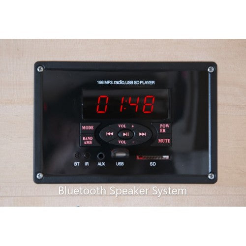 Bluetooth speaker system with digital display and control buttons on a wooden surface