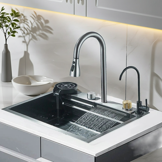 Modern kitchen sink with dual faucets in a clean, white kitchen setting.
