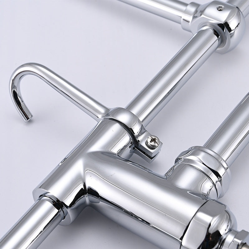 Chrome kitchen faucet on a light gray background