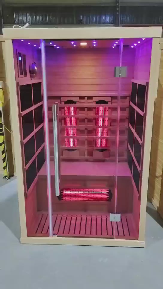 Infrared sauna with wooden exterior and glass door on a white 